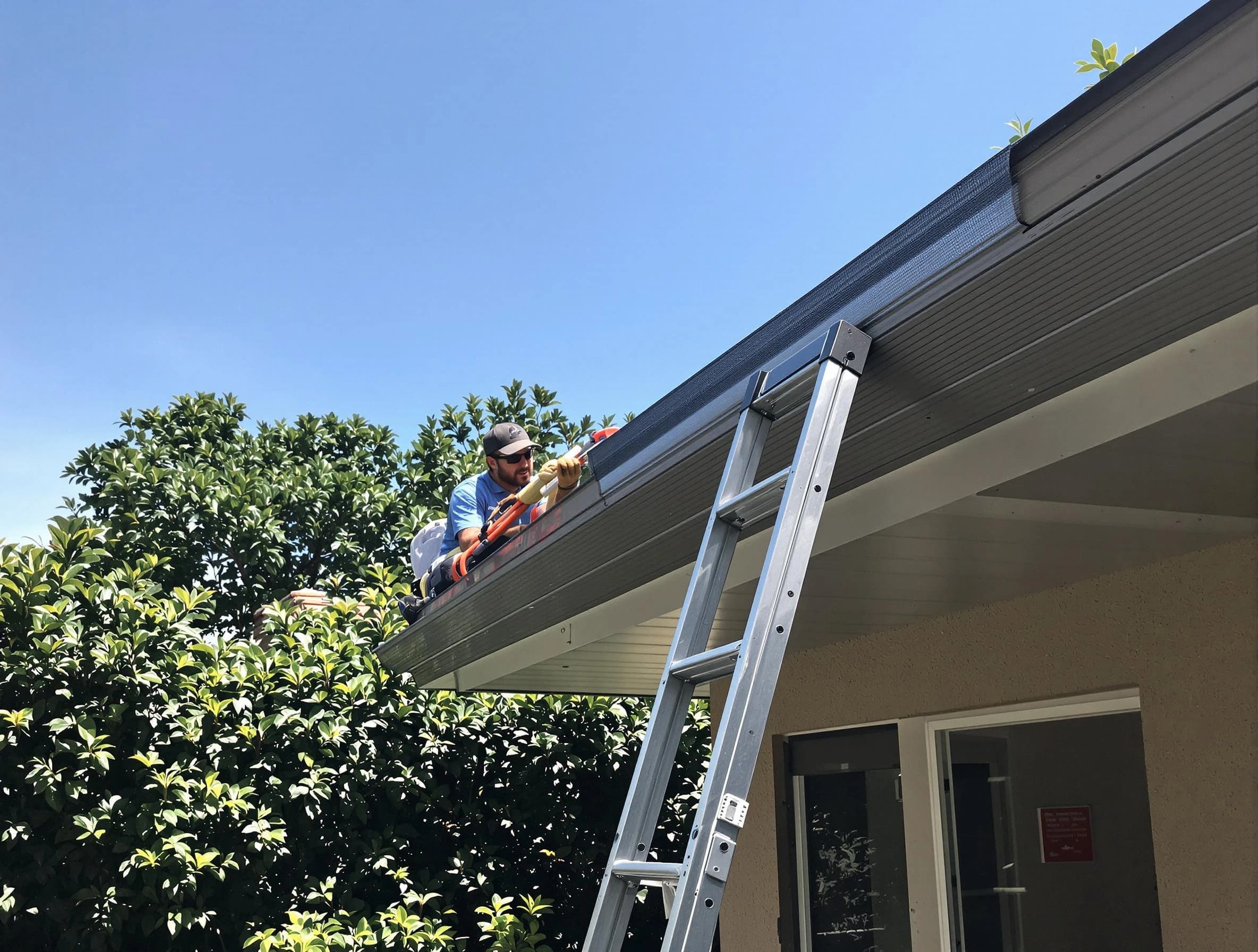 Beachwood Roofing Company installing gutter guards for a homeowner in Beachwood, OH